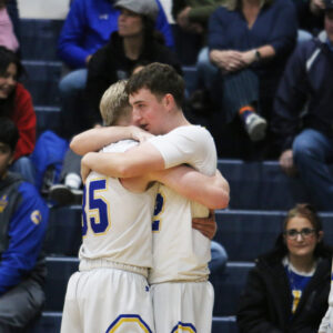 Dempsey Jenkins and Jack DeLong hug after the last game they will ever play together./ Ron Espinola • The Brand