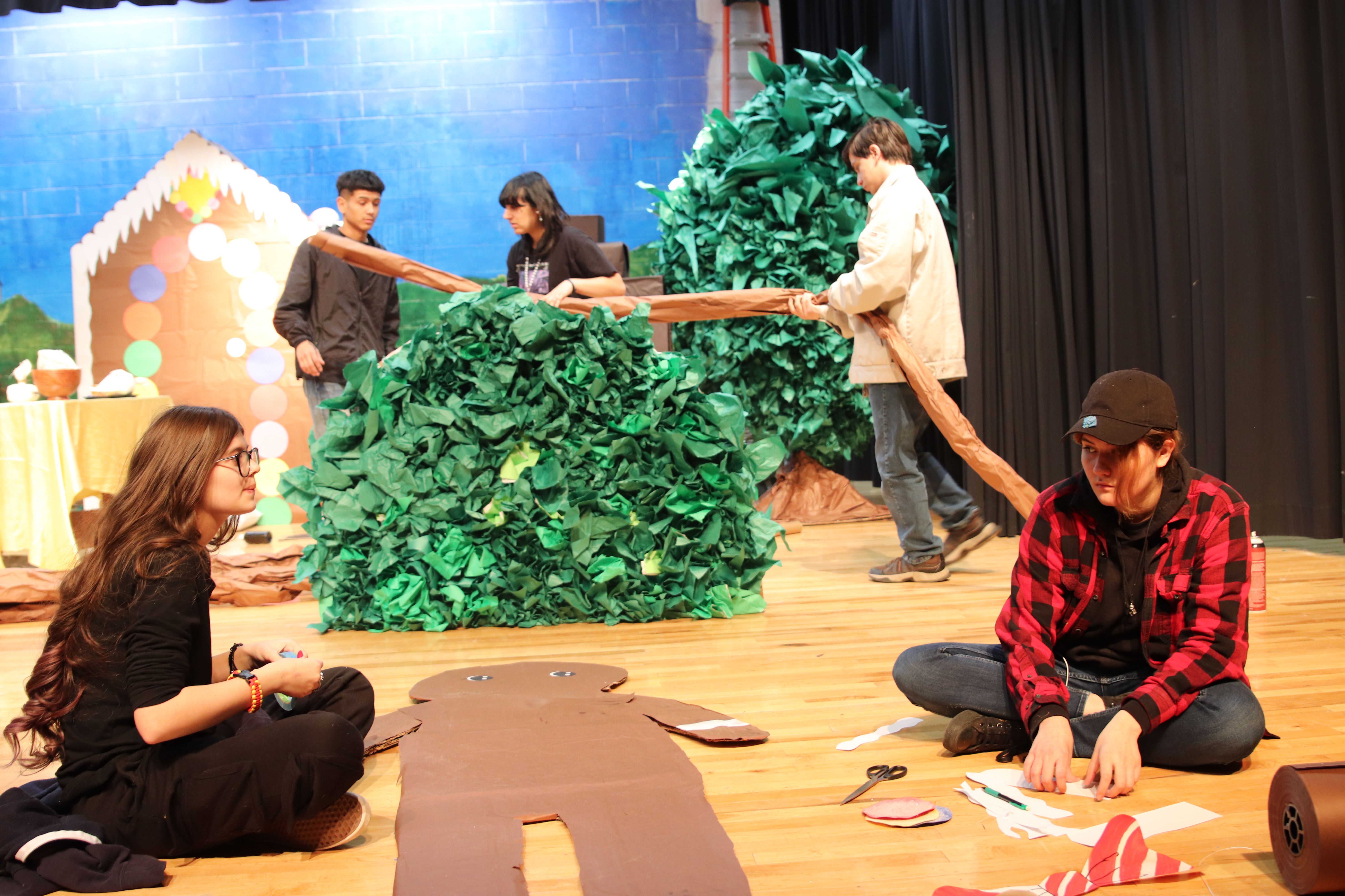 Stagecraft students working on the set and props for “Hansel and Gretel”. /Ron Espinola • The Brand
