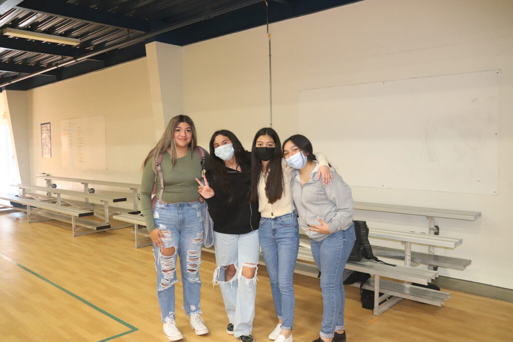 Karen Guillion, Juliana Carrillo, Itzel Diaz, and Jazmin Bautista pose together for a picture during physical education class./ Ron Espinola • The Brand
