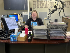 Ms Mandi Whitted at work in the Attendance Office. /Ron Espinola • The Brand