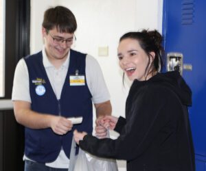 Ryan Magoon checks Lexi Allen’s receipt./Gavin Swanson •The Brand