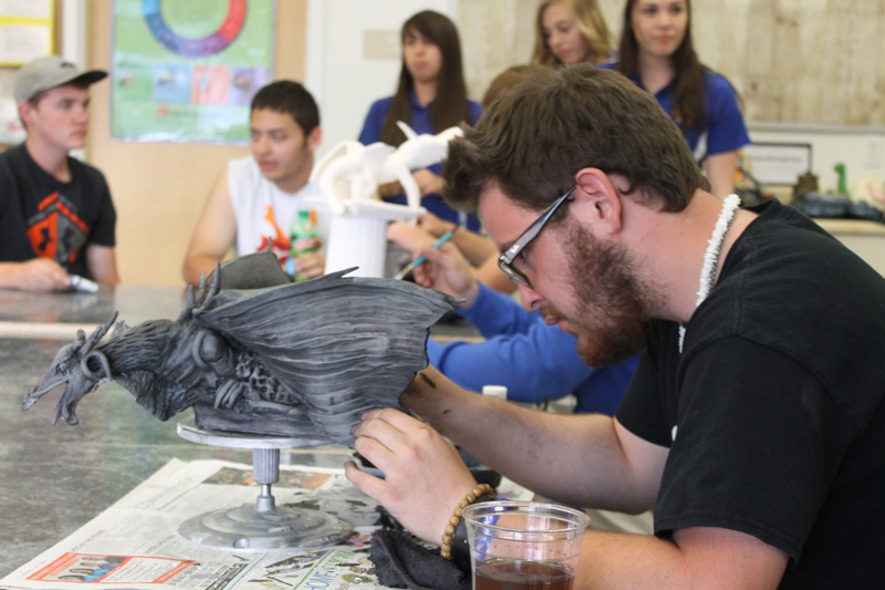 Brycen Prokaksy makes finishing details on his gargoyle./Liam Gallups •The Brand 