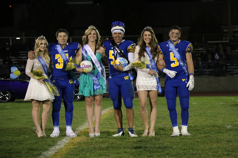 Homecoming royalty candidates pose for a picture during the halftime show./ Aimee Brandon •The Brand 