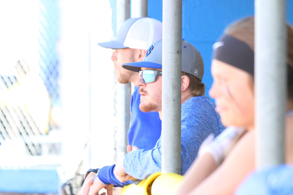Coach Austin Mayo looks on during a varsity softball game last year./Ron Espinola • The Brand