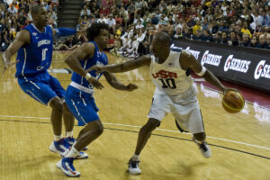Kobe Bryant, USA Olympic Men's Basketball player, dribbles against players from the Dominican Republic during a pre-Olympic exhibition game on July 12, 2012, at the Thomas & Mack Center, Las Vegas, Nev. This will be Bryant's second time playing on the USA Olympic Men's Basketball team (U.S. Air Force photo by Airman 1st Class