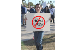 A student with his well written protest sign. /Courtesy