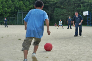 Aug. 22, 2007) - USS Juneau (LPD 10) Sailors play kickball with the children of the Tenshin-ryo Children's Home after a community relations project (COMREL). The COMREL focused on the moral needs of the children by cleaning, painting and repairing their playground area. U.S. Navy photo by Mass Communication Specialist 2nd Class Joshua J. Wahl (RELEASED)