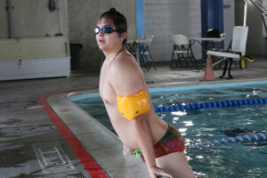 Evan Jeppsen posing with his lucky floaties./Araceli Galarza • The Brand