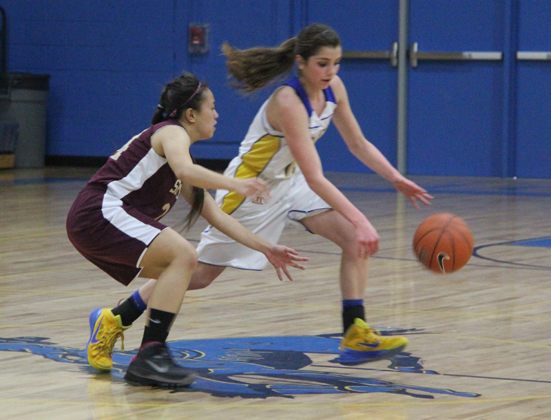 Brooklyn Waller dribbles past a defender./ Weston Irons• The Brand