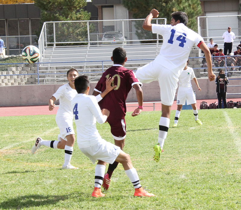 Roberto Sanchez (14) goes up to intercept a pass./Brody Goucher • The Brand