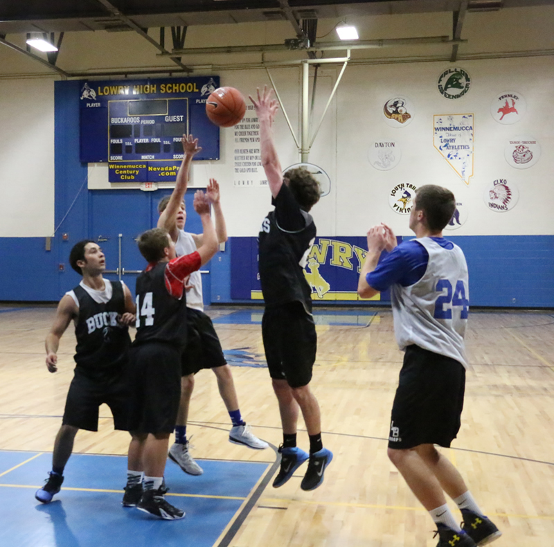 Jed Teichert makes a pass to Brody Goucher (24)./Weston Irons • The Brand