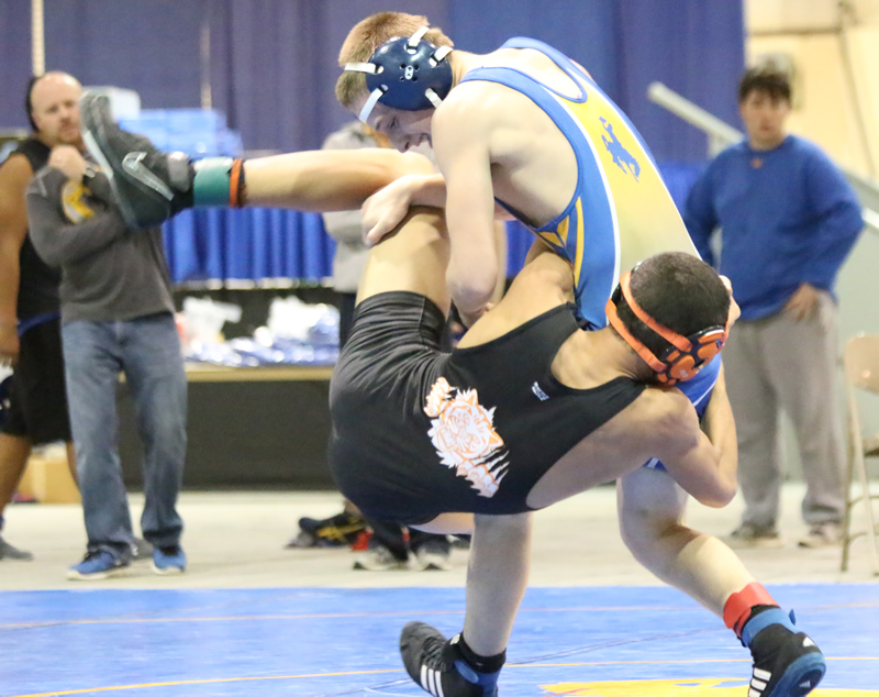 Ryan Johnson battles hard to take down his opponent./Maclyn Crnkovich  •  The Brand