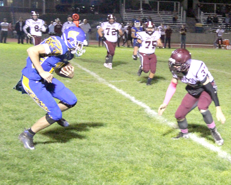Brady Lange avoids a defender./Aimee Brandon • The Brand