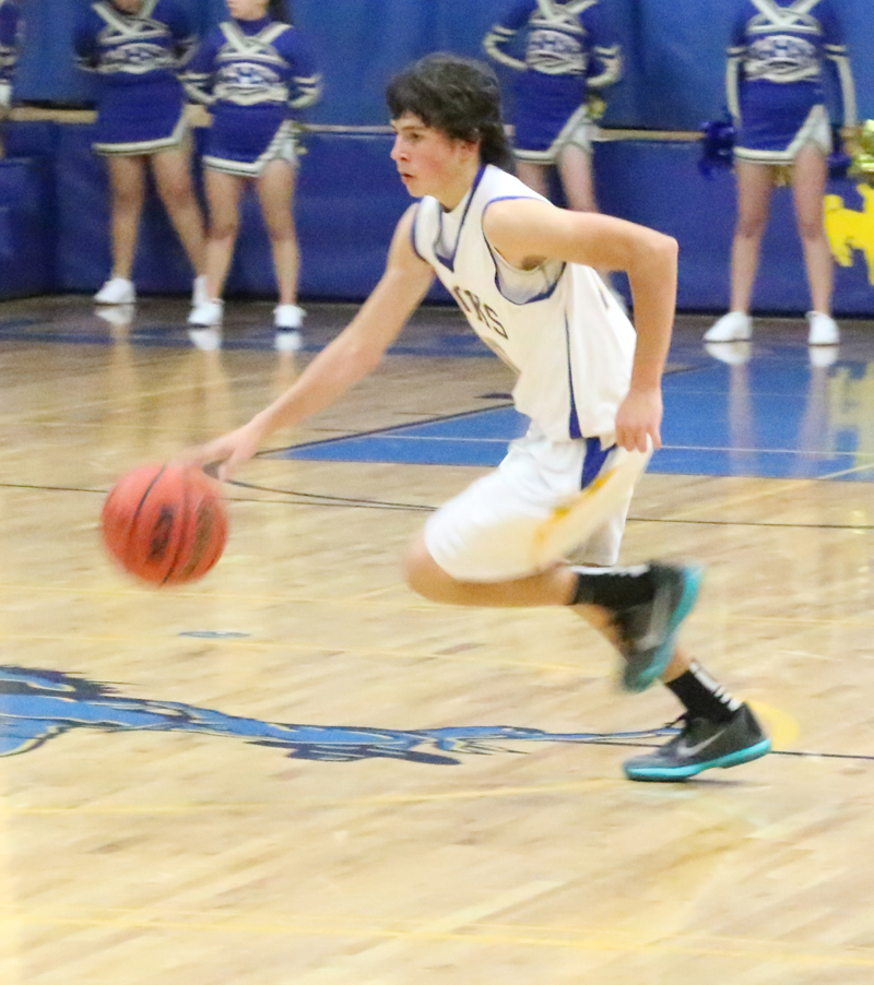 Cole Smith dribbling./Brody Goucher • The Brand
