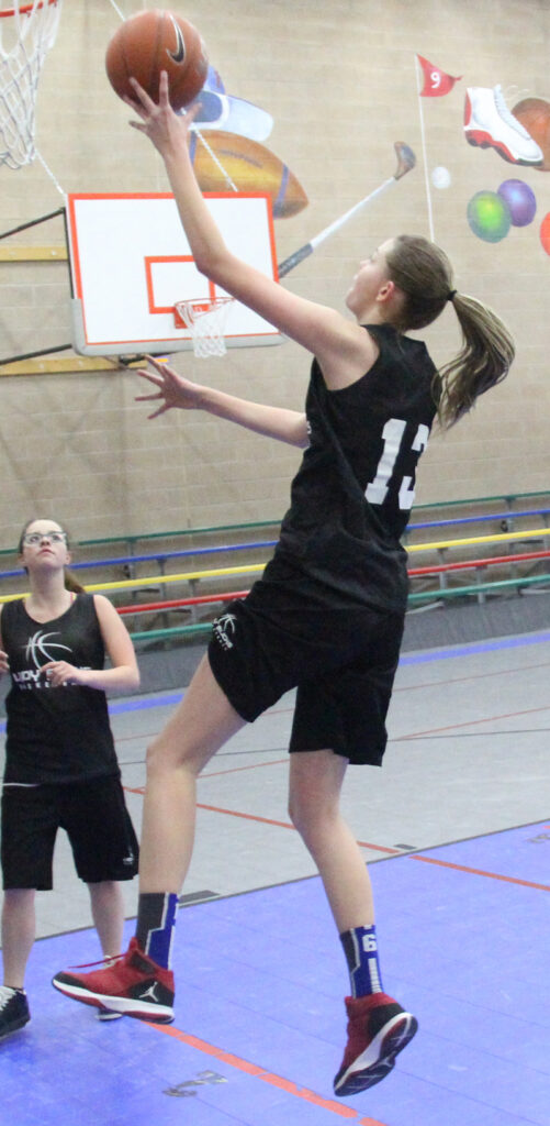 Brooke Hansen goes in for a layup./Brody Goucher • The Brand