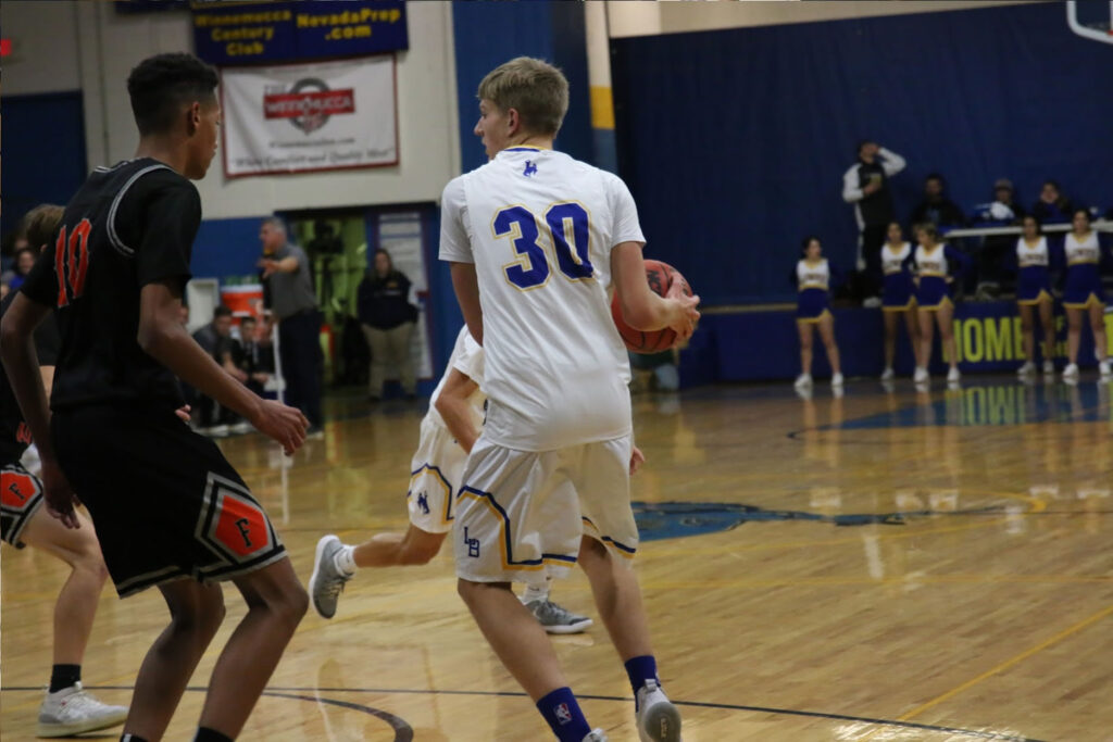 Klay Garner looks for an open teammate during the game against Fernley./Alesha Houston • The Brand