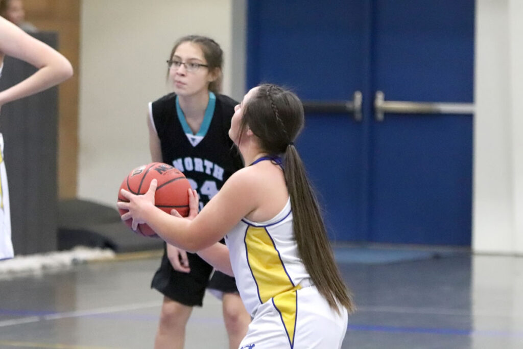 Amanda is prepares to shoot the ball./Ron Espinola • The Brand