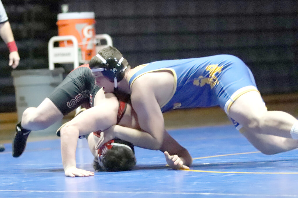 Josiah Chapman takes his opponent to the mat./Ron Espinola • The Brand