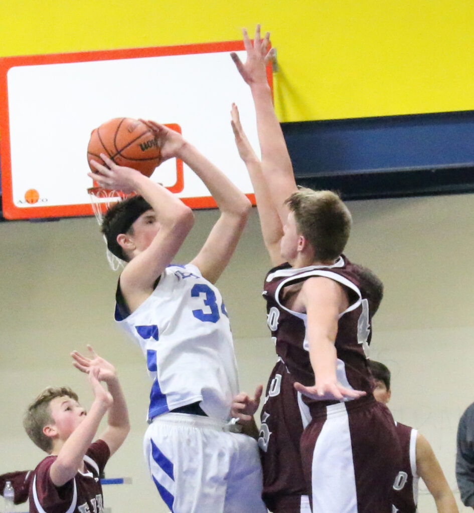 Dillon LaRose gets triple-teamed./Ron Espinola • The Brand