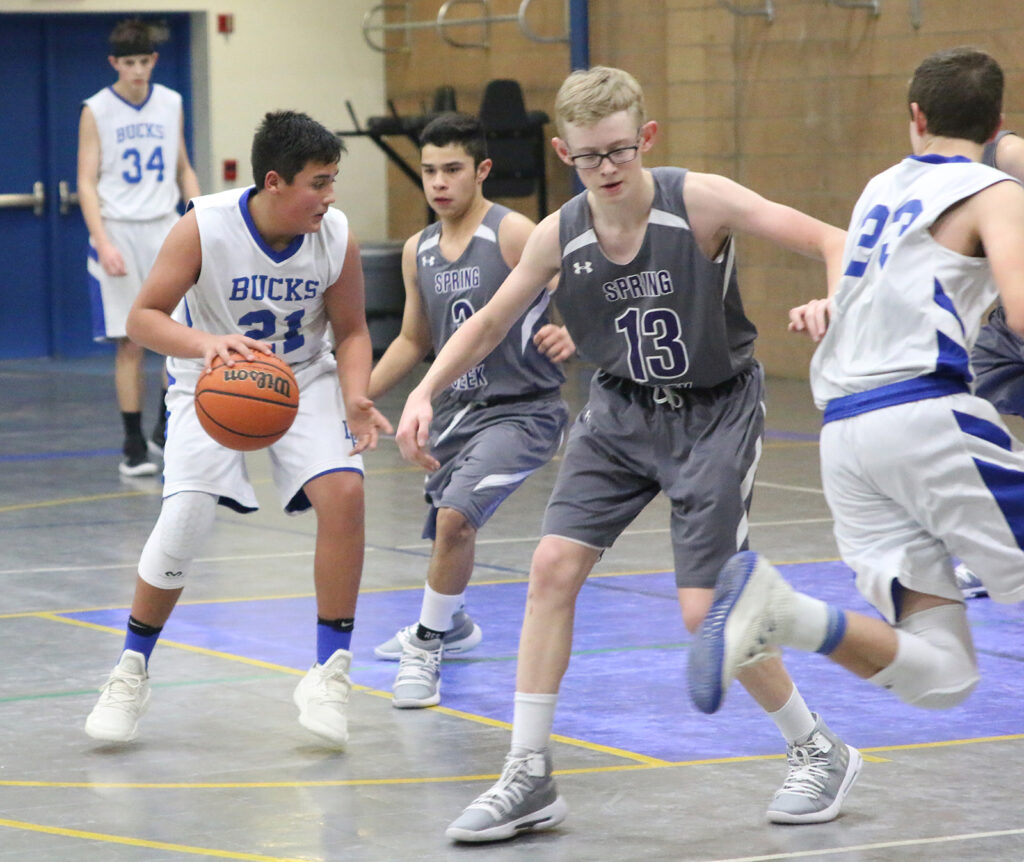 Wyatte Sakurada looks to get through the Spartan defense./Ron Espinola • The Brand