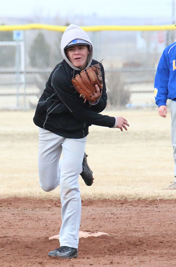 Ridge Rickets throwing the ball to first./ Ron Espinola • The Brand