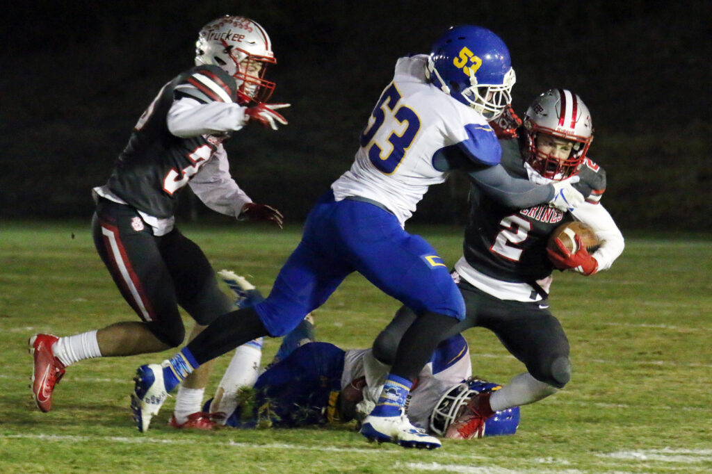 Gratian Dawson (53) tackles a Truckee ball carrier./Ron Espinola • The Brand