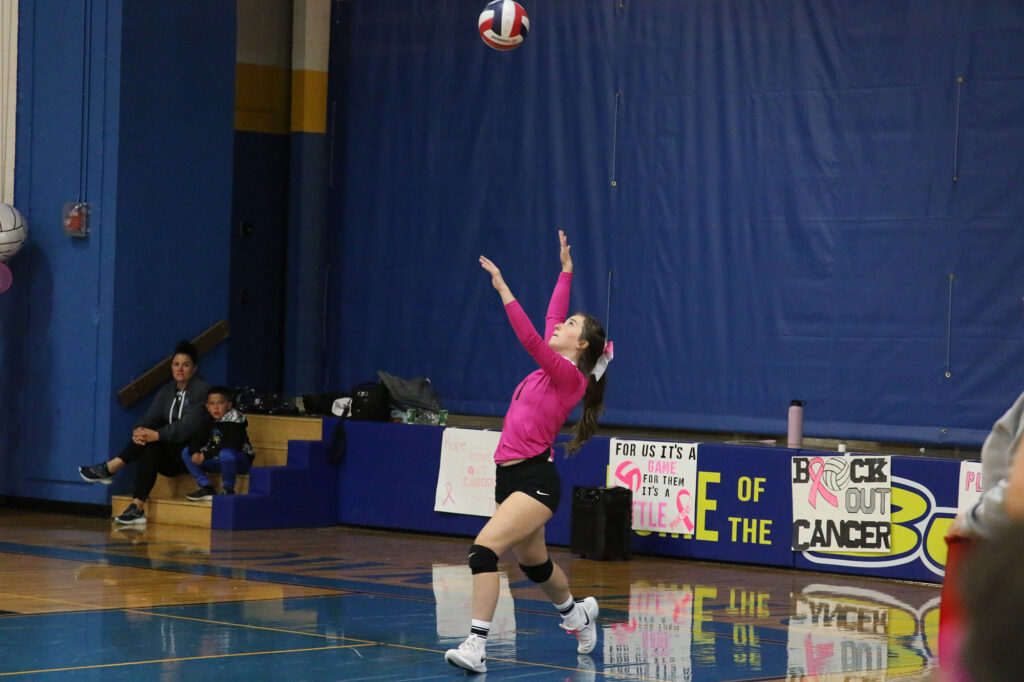 Carley Capellen serves./Faith Holland • The Brand