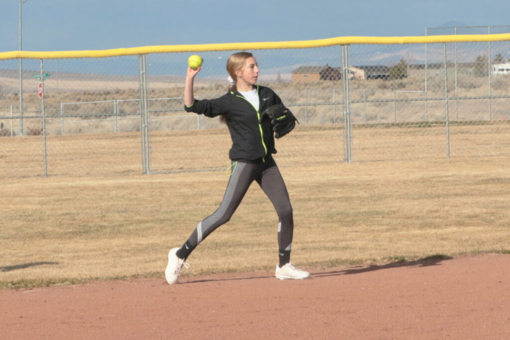 Shelbie Hoyt throws to first base./Ron Espinola • The Brand