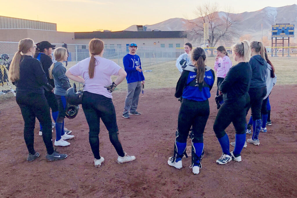 Coach Austin Mayo talks to the team at practice. /Courtesy • Dana Peters