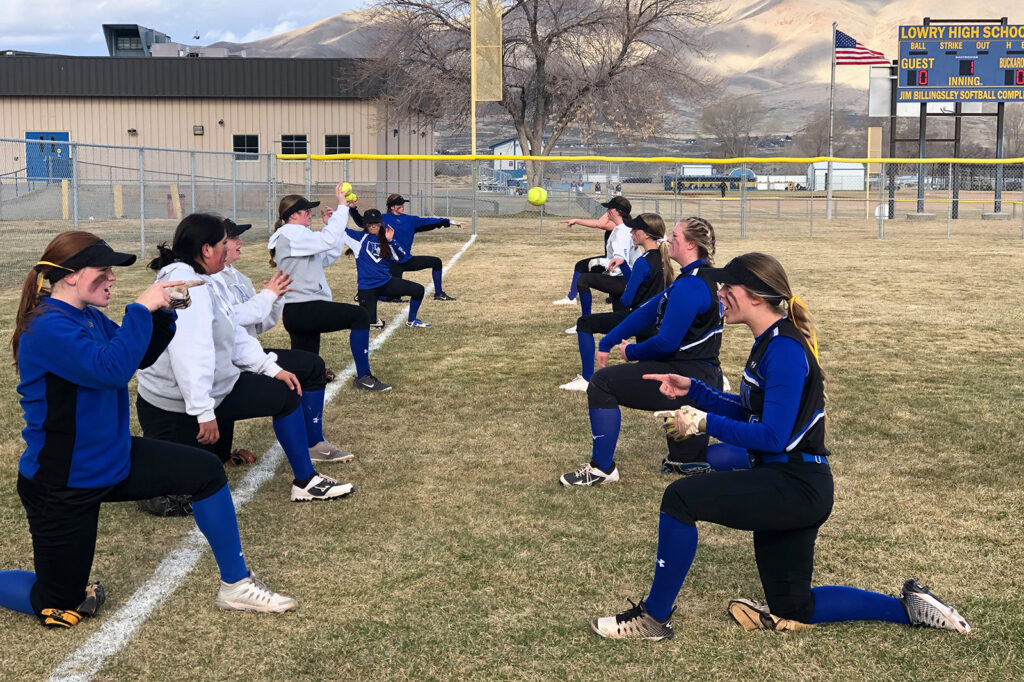 The softball team warms up for Spring Creek. /Courtesy • Dana Peters