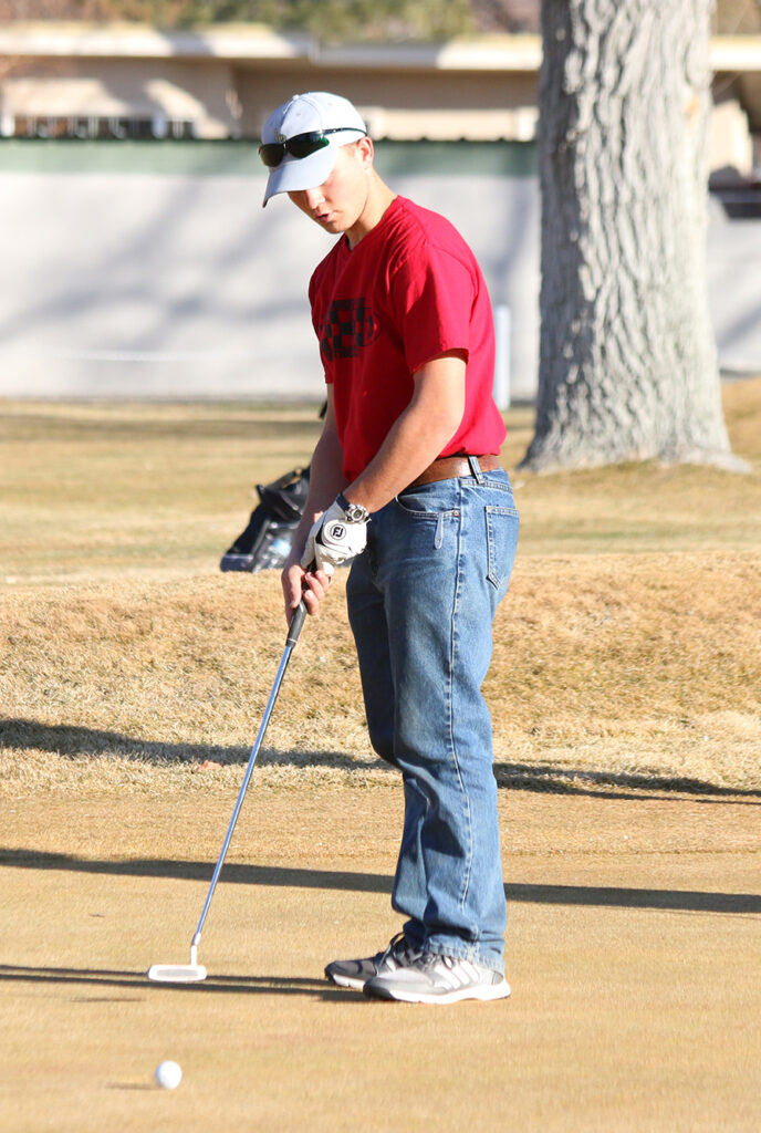Tyler Moser sets up to hit the ball/Mackie Grady • The Brand