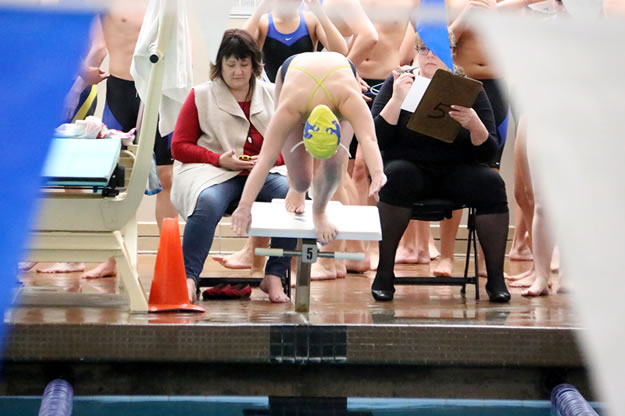 Casalyn Perkinson dives off the block./ Halle Sullivan • The Brand
