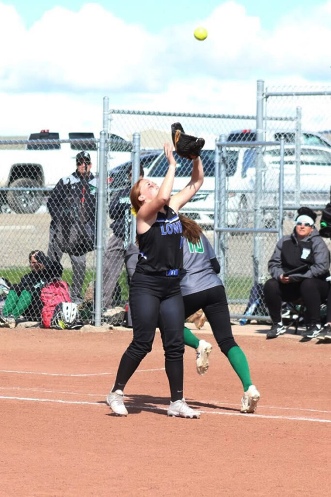 Sierra Maestrejuan is about to catch the softball hit by Fallon./Ron Espinola • The Brand