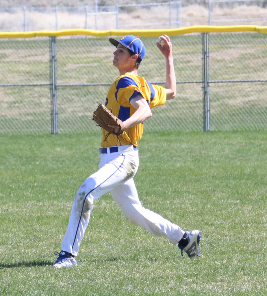 Chris Schultz makes a throw from right field./Ron Espinola • The Brand
