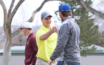 Kobe Stoker and coach Andrew Meyer share a moment together./Mackie Grady • The Brand