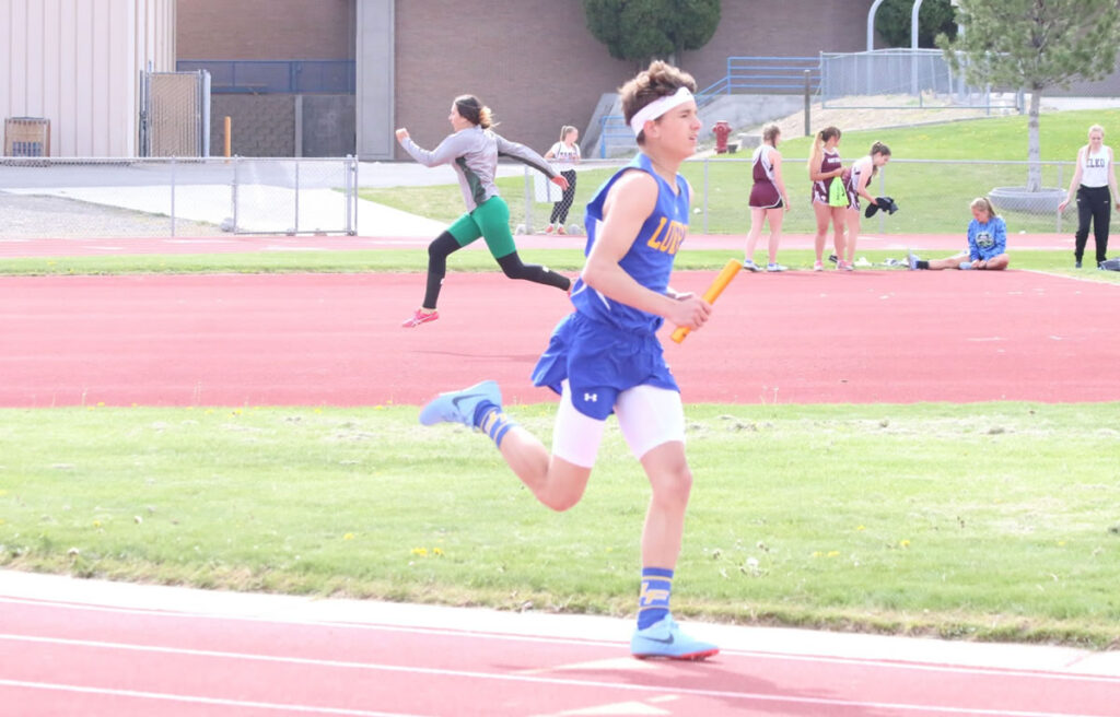 Sam Roth runs the 4x800 relay./ Clarissa Olson • The Brand