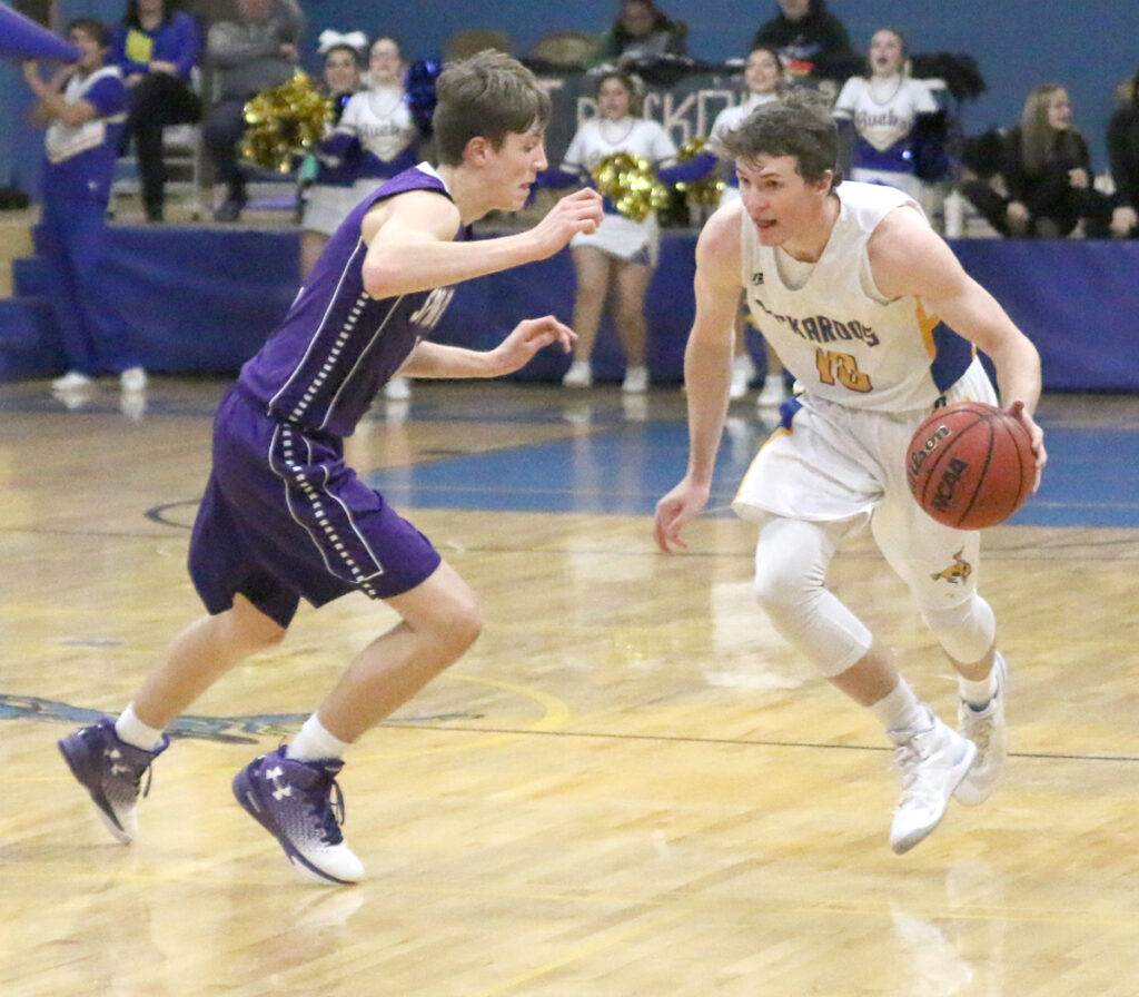 Brady Lange dribbling down the court./Aimee Brandon • The Brand