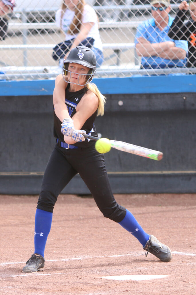 Alanna Miller getting a hit./Dylan Kalkoske • The Brand