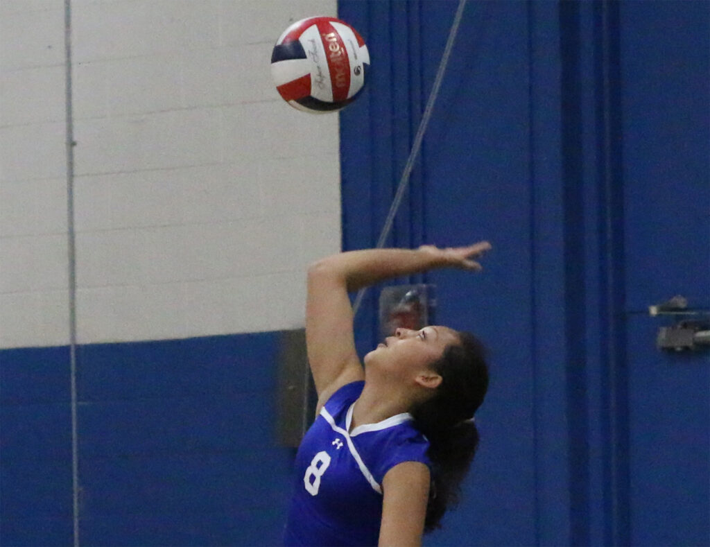 Serving against Churchill County./Dylan Kalkoske • The Brand