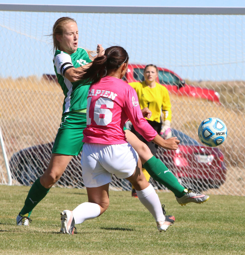 Bailey Sapien gets a shot off against Churchill./Dylan Kalkoske • The Brand