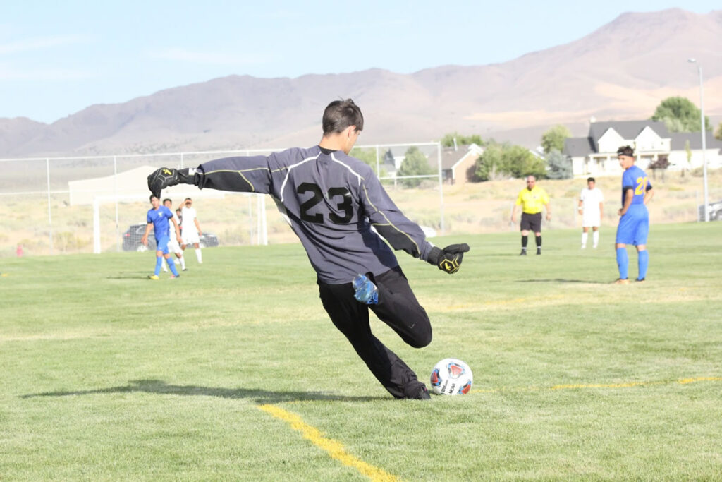 Chris Schultz plays the ball to his teammates./Ron Espinola • The Brand