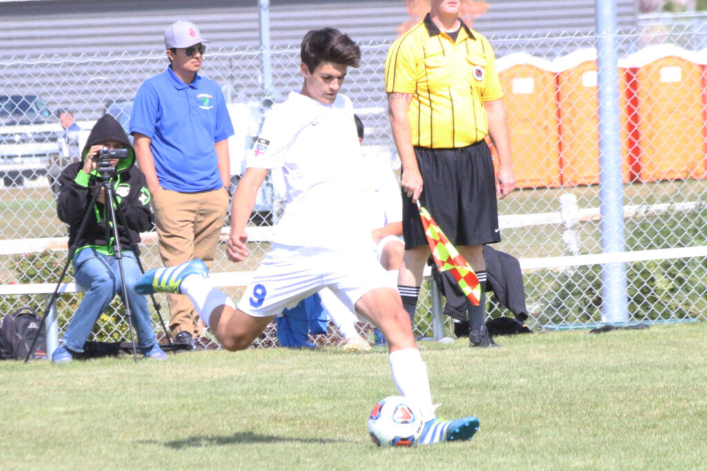 Nathan Kepler kicks the ball away./Ron Espinola • The Brand