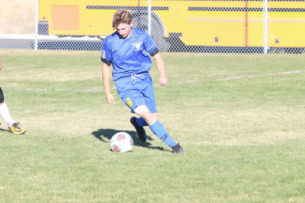 Austin Lloyd dribbles the ball./Mackie Grady • The Brand