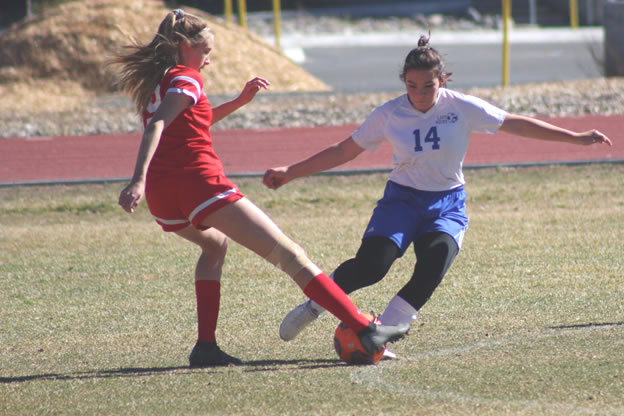 Kenzi Dowd-Smith steals the ball from the opposing team. /Courtesy • Blaine Olson 
