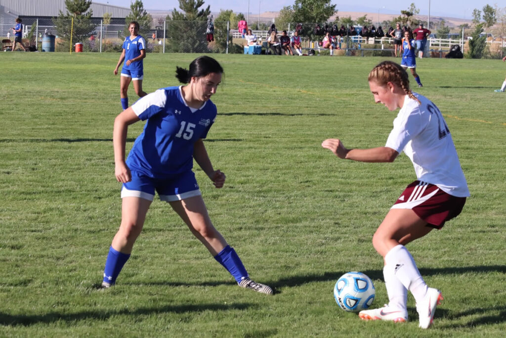 Macy Delong defends against an Elko striker. /Courtesy • Taylor Gleason
