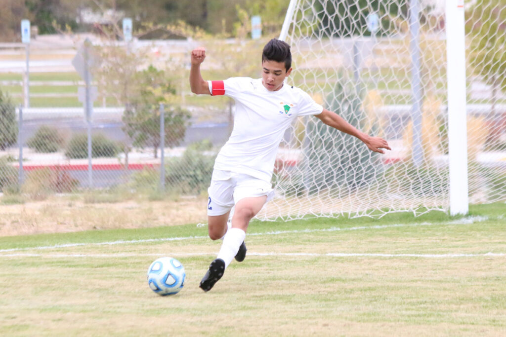 Brandon Lee kicks ball down the field./ Ron Espinola • The Brand