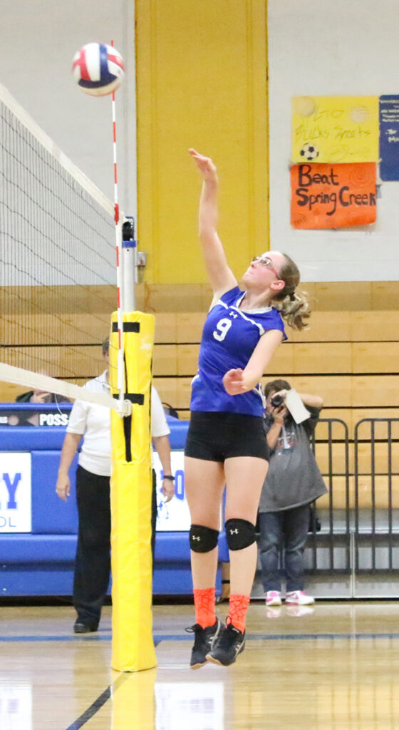 Sophomore Destiny Starkey sends the ball over the net./Ron Espinola • The Brand