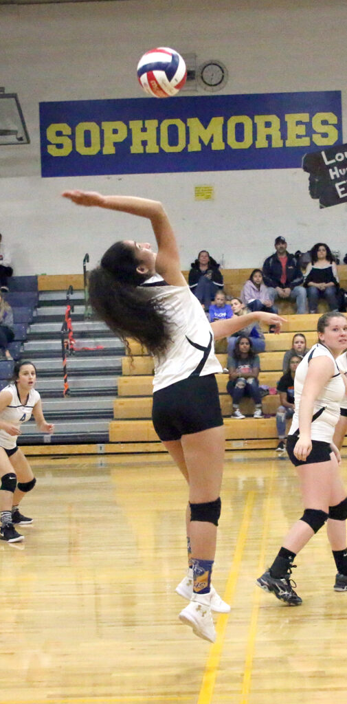 Juliana Ruiz jumps to spike the ball./ Ron Espinola • The Brand