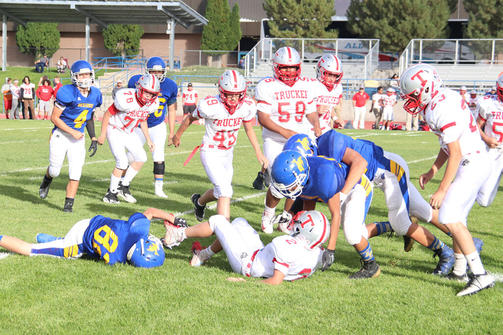 The Bucks gang tackle a Truckee player./Melanie Magaña  • The Brand