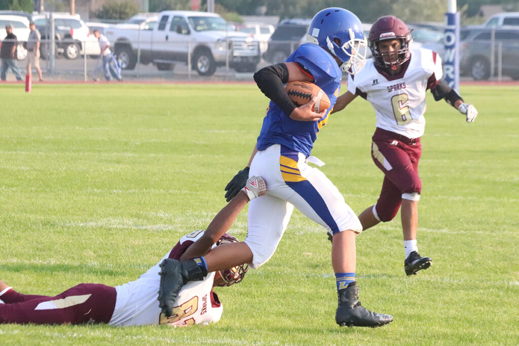 Joseph Garcia escapes a tackle./Ron Espinola • The Brand